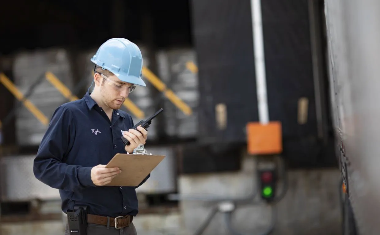 Crew lead on a two-way radio