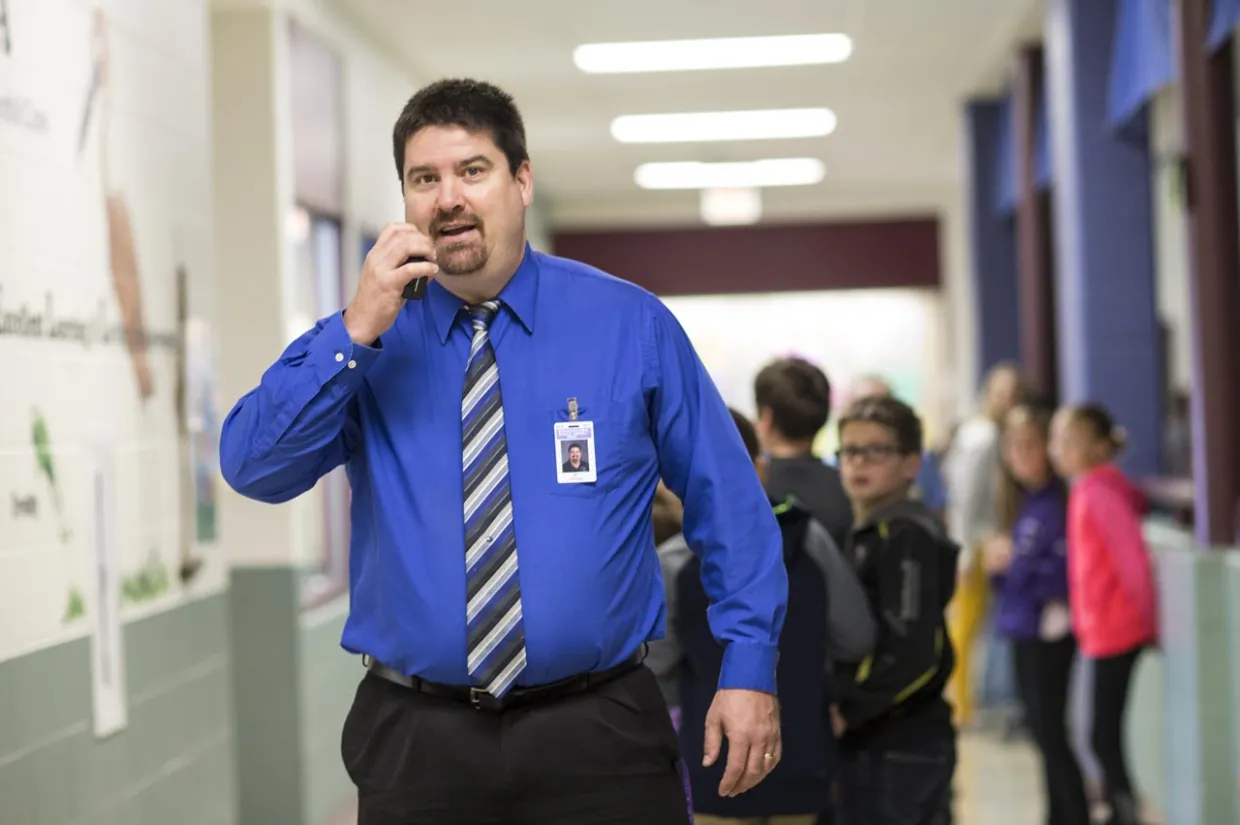 Principal using two way radio