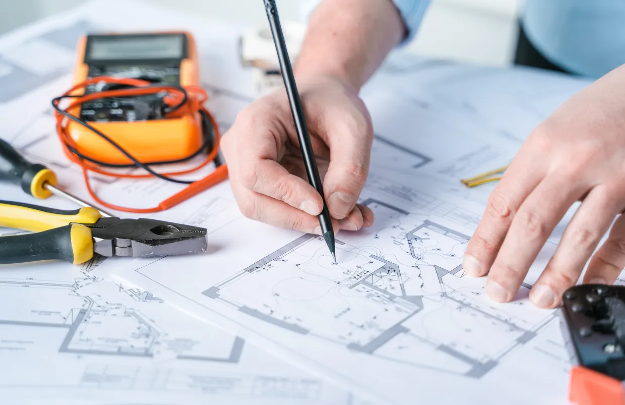 Man writing blueprint system diagram 